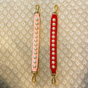 Beautiful dog collars one in red and the other in pink